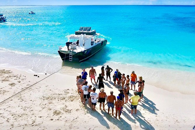 4hour Group Half Day Snorkeling Excursion in Grace Bay - The final swim stop: rooftop board and curved slides