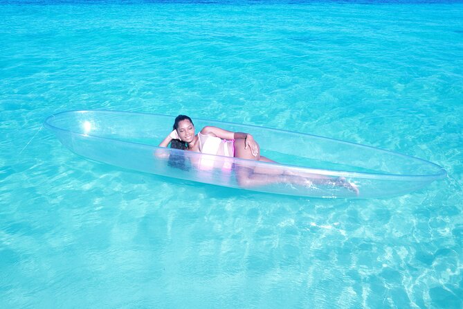 Clear Kayak Drone Photoshoot , Providenciales, Turks and Caicos - Getting into the clear kayak at the beach